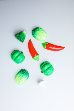 Chilli pepper and green chili pepper on a white background, top viewの写真素材