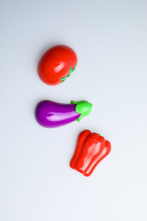 Eggplant, tomato and pepper isolated on a white background.の写真素材