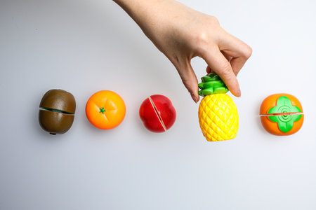 Colorful painted wooden toys on a white background. Top view.の写真素材