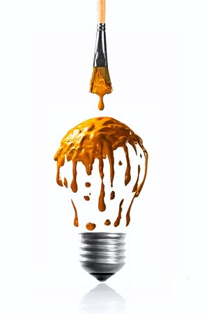 Warm orange color dripping making a light bulb shapeの写真素材