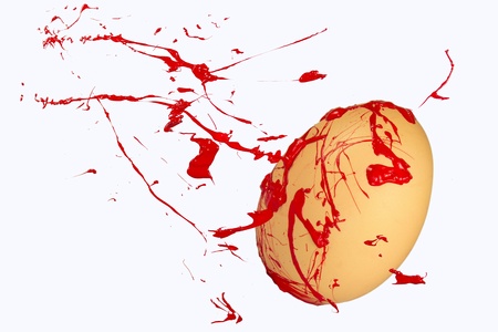 Red paint sprays on the easter eggの写真素材