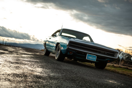 Classic american old car on the road at sunset.のeditorial素材