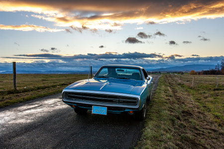 Classic american old car on the road at sunset.のeditorial素材