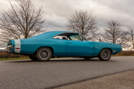 Classic american car on the road at sunset, motion blur. Dodge Charger 500 1970のeditorial素材