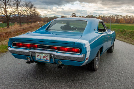 Classic american car on the road at sunset, motion blur. Dodge Charger 500 1970のeditorial素材