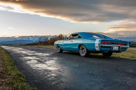 Classic american car on the road at sunset, motion blur. Dodge Charger 500 1970のeditorial素材