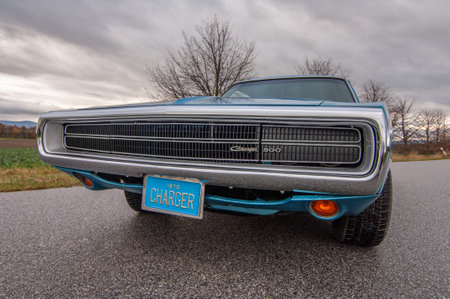Classic american car on the road at sunset, motion blur. Dodge Charger 500 1970のeditorial素材
