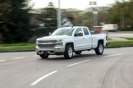 Pickup truck on the road in the city. Motion blur.のeditorial素材