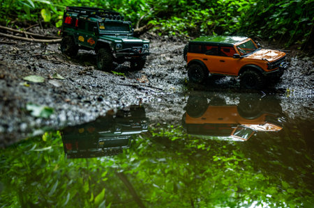 Truck in the mud with reflection on the water. The concept of extreme sports.