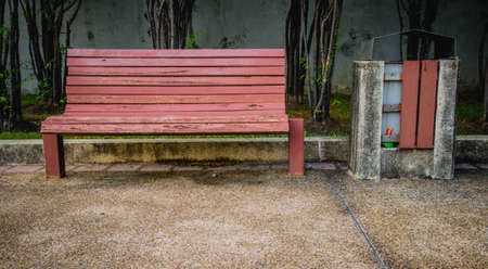 Red bench with the binの写真素材