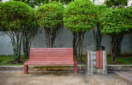 Red bench with the bin