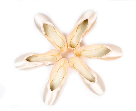brand new ballet shoes on a white background