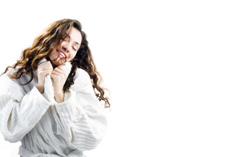 girl in a bathrobe on the wite backgraundの写真素材