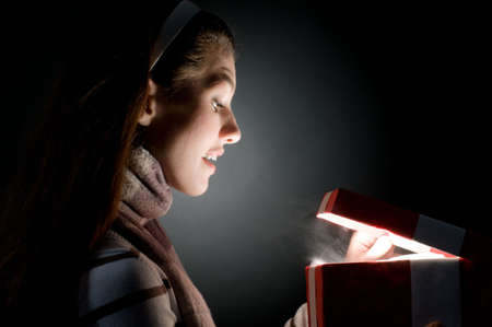 a beautifull girl opening  x-mass magic presentの写真素材