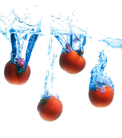 crystal clear water splashing from a fruitの写真素材