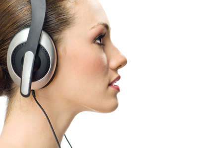girl in headphones on the white backgroundの写真素材