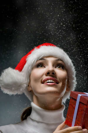young girl with christmas present in handsの写真素材