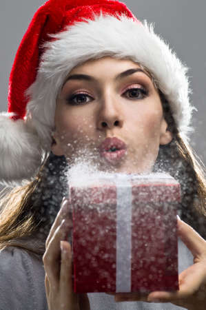 young girl with christmas present in handsの写真素材