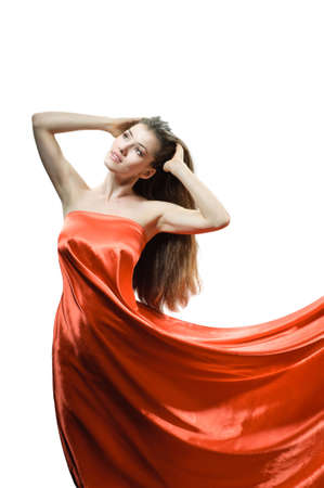 beautiful young woman in red long dressの写真素材