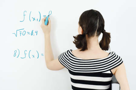 young beautiful girl standing by the boardの写真素材