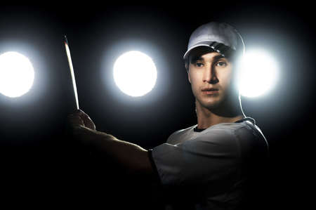 Baseball player with a bat in stadiumの写真素材