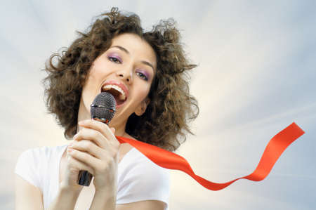 pretty girl singing at the revelry partyの写真素材