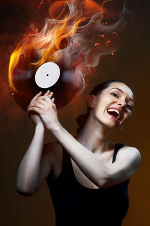 she held in her hand musical recordの写真素材