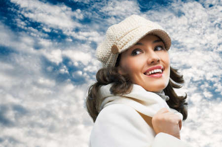 a beauty girl on the sky backgroundの写真素材
