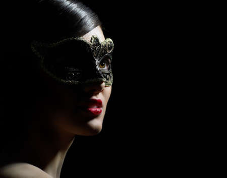 cute girl in masquerade maskの写真素材