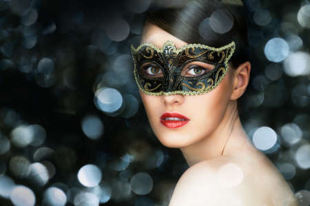cute girl in masquerade maskの写真素材