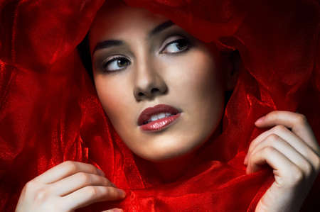 beautiful girl in the red fabricの写真素材