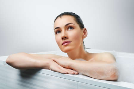 beautiful girl lying in the bathroom