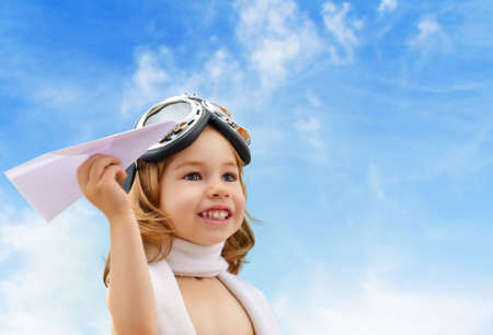 A child plays an airplane pilotの写真素材