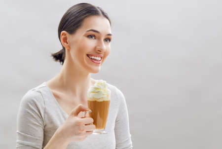 Woman with an aromatic coffee in hands