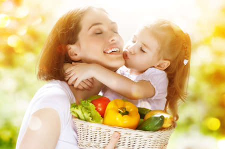 happy family keeps fresh vegetablesの写真素材