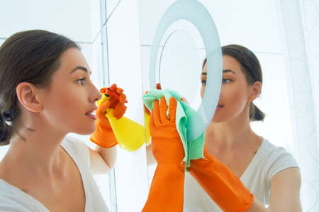 beautiful girl cleans the surfaceの写真素材