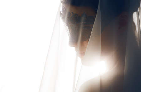 cute girl in masquerade maskの写真素材