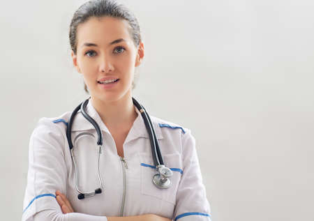 successful doctor on the grey backgroundの写真素材