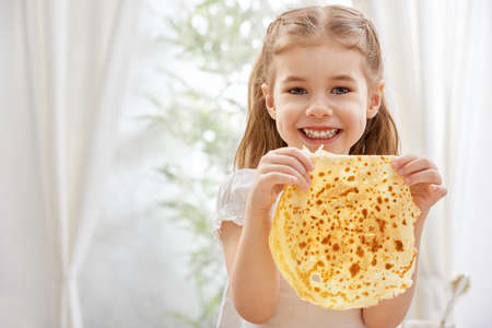 beauty child prepare pancakes