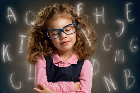 beauty child at the blackboardの写真素材