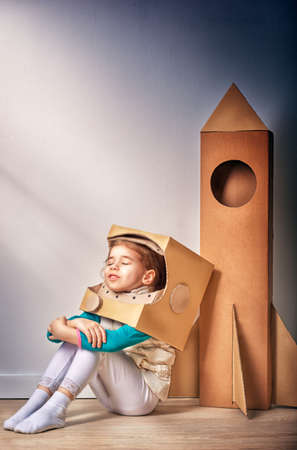 child is dressed in an astronaut costumeの写真素材
