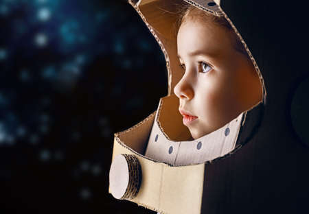 child is dressed in an astronaut costumeの写真素材