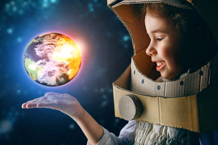 child is dressed in an astronaut costumeの写真素材