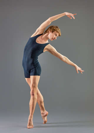 modern ballet dancer on grey backgroundの写真素材