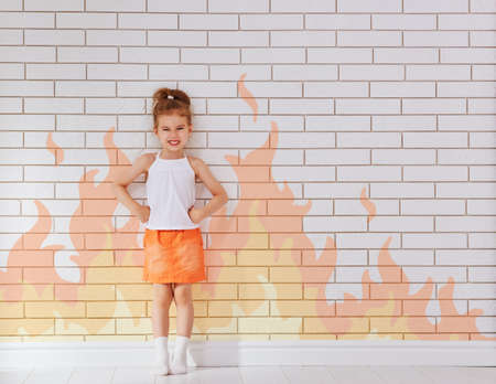 angry child on the wall backgroundの写真素材