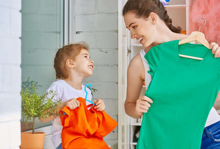 a family is trying on clothesの写真素材