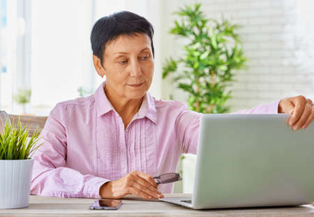 senior woman working with her laptop