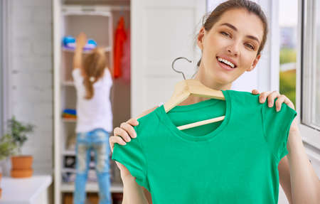 a family is trying on clothesの写真素材