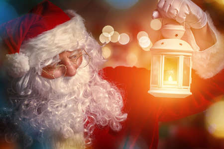 Portrait of Santa Claus with lantern in hand.の写真素材