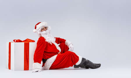 Santa Claus and huge gift.の写真素材